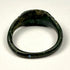 Eastern Mediterranean Roman bronze finger ring with broad integral bezel and simple geometric shoulder decoration