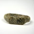 Side view of Late Roman bronze finger ring with angular shoulders and engraved linear motifs