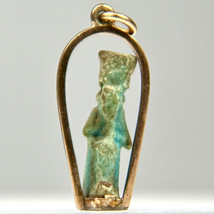 Small Ancient Egyptian faience deity amulet with turquoise glaze remains, mineral deposits, and a later custom gold pendant mount.
