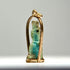 Late Period to Ptolemaic Egyptian amulet showing a standing protective or funerary figure with worn blue-green glaze and gold setting.