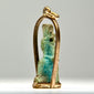 Ancient Egyptian faience pendant amulet with stylized divine figure, original suspension perforation, and later gold frame.