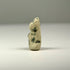 Late Period to Ptolemaic Egyptian faience cat amulet with upright ears, seated posture, and naturally weathered surface.