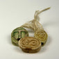 Group of three Ancient Egyptian scarab amulets in steatite and glazed composition, including incised hieroglyphic and green-glazed examples.