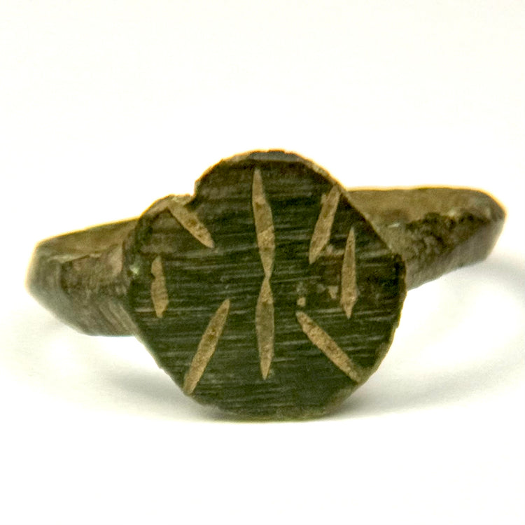 Ancient Eastern Mediterranean bronze ring with radiate geometric face