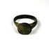 Ancient Roman-Byzantine bronze ring viewed from the side, showing broad shoulders, worn bezel, and naturally aged green patina