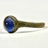 Rear view of Roman bronze finger ring showing slender aged band and circular stone setting