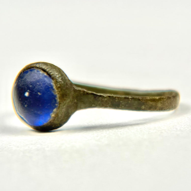 Rear view of Roman bronze finger ring showing slender aged band and circular stone setting