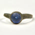 Front view of Roman bronze ring with domed cobalt blue glass stone in circular bezel