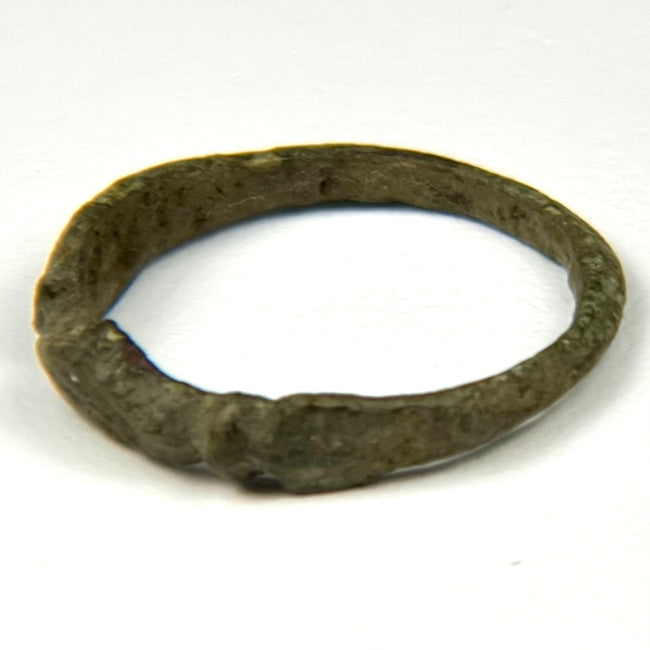 Roman Imperial bronze ring showing worn engraved palm-frond design on the flattened bezel