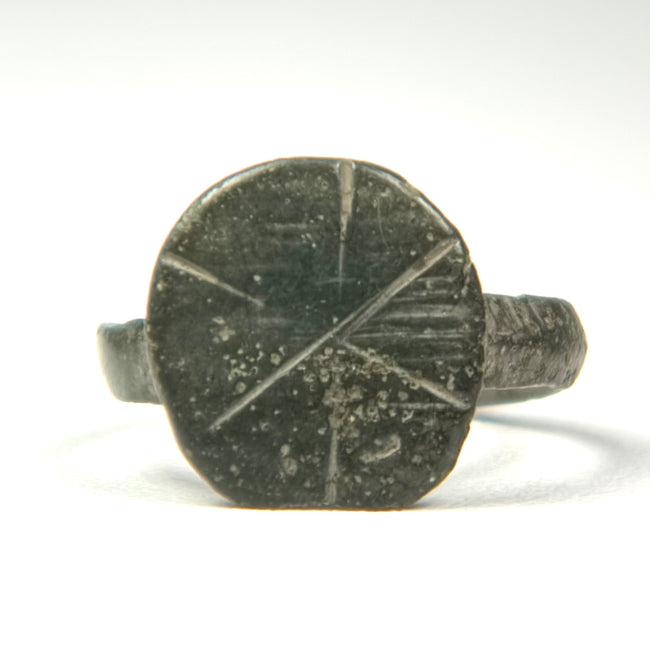 Ancient Byzantine bronze finger ring with oval engraved cross motif and aged green patina