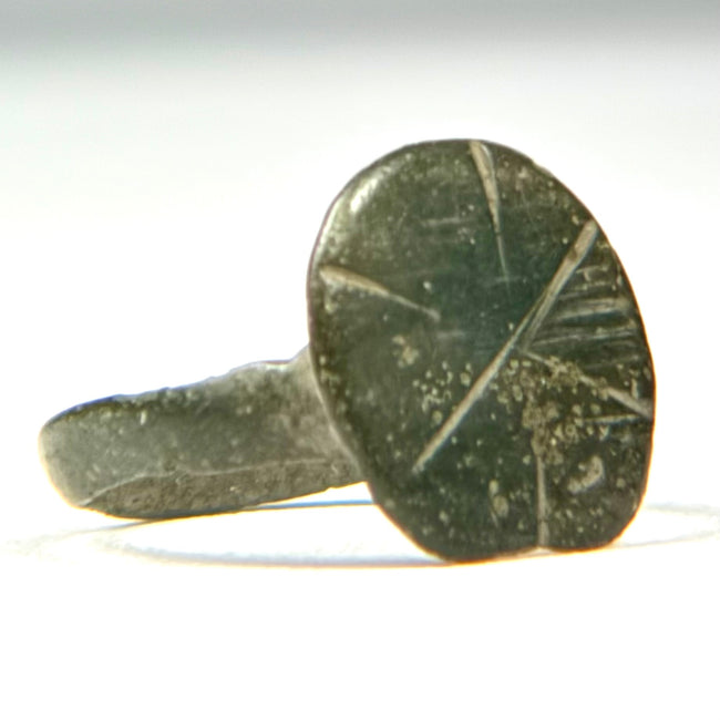 Side profile of Early Byzantine bronze ring with raised oval signet bezel and ancient surface patina