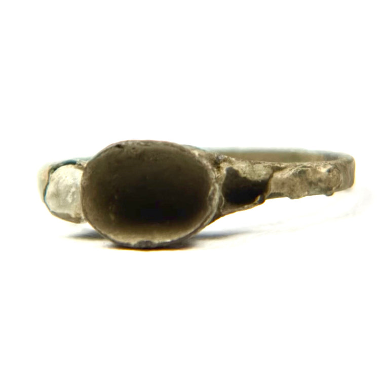 Ancient bronze finger ring with small round bezel and raised setting, Late Roman to Early Byzantine jewelry