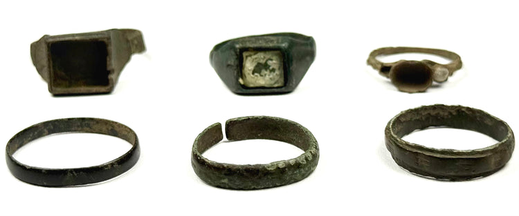 Six ancient bronze finger rings including square bezel, inset, round bezel and plain band forms from the Roman and Byzantine periods