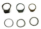 Top and front views of six ancient bronze finger rings with decorative bezels and simple bands, circa 3rd–7th century CE