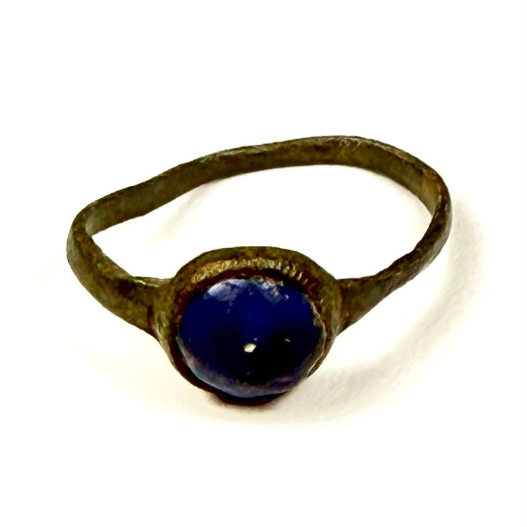 Ancient Roman bronze and blue glass finger ring displaying original surface wear and patina