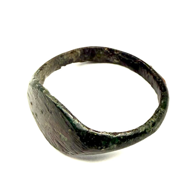 Rear view of Roman bronze ring displaying aged band, surface wear, and natural green patination