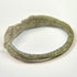 Rear view of Roman bronze finger ring showing complete oval hoop and natural age-related wear