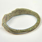Rear view of Roman bronze finger ring showing complete oval hoop and natural age-related wear