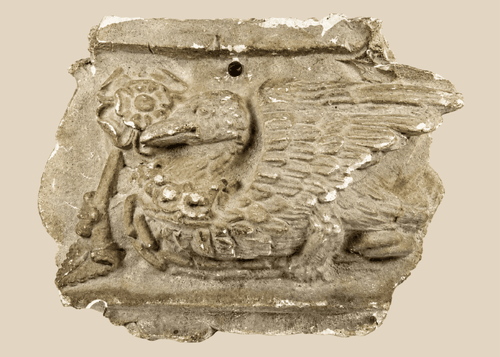 Early 20th-century plaster relief of a medieval griffin with wings, referencing Westminster Coronation 1902