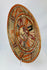 Alternate left-front perspective emphasizing sunburst pattern and pigment mineralization on surface.