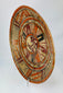 Alternate left-front perspective emphasizing sunburst pattern and pigment mineralization on surface.