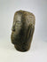 Three-quarter angle of an 18th–19th century Polynesian ancestor head carved from basalt.