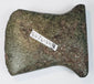 Small ancient Andean stone axe circa 500–1500 CE with notched sides, use-worn cutting edge, and original archaeological tag.