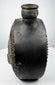 Pre-Columbian ceramic flask with stepped border surrounding a modeled face