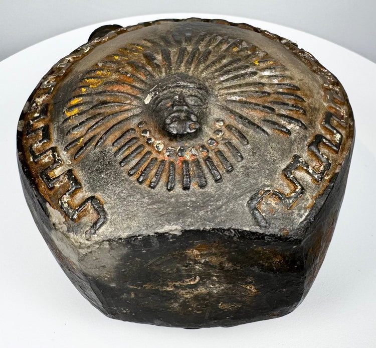 Ancient Peruvian blackware vessel with circular body and prominent loop handle