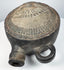 Andean pottery vessel with elaborate headdress imagery and tubular spout