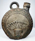 Ancient Peruvian pottery flask with radiating headdress and stepped geometric border