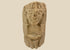 Pre-Columbian carved stone idol from West Mexico or Andean Highlands, circa 500–1000 CE, hand-carved volcanic stone or sandstone, stylized anthropomorphic features with almond-shaped eyes and geometric body, compact ritual or domestic shrine figure