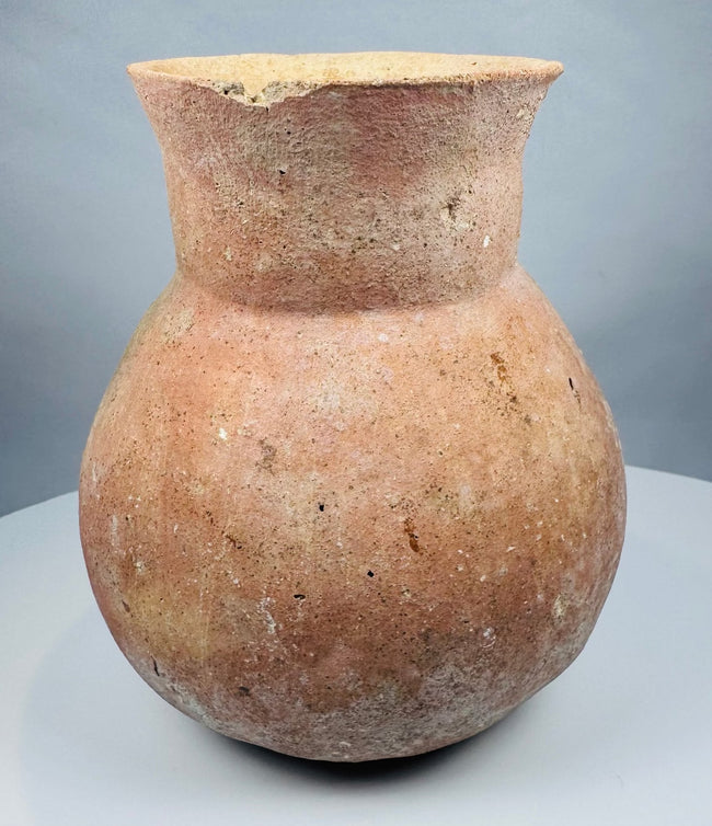 Underside of a Pre-Columbian earthenware vessel showing stabilized cracks and restoration