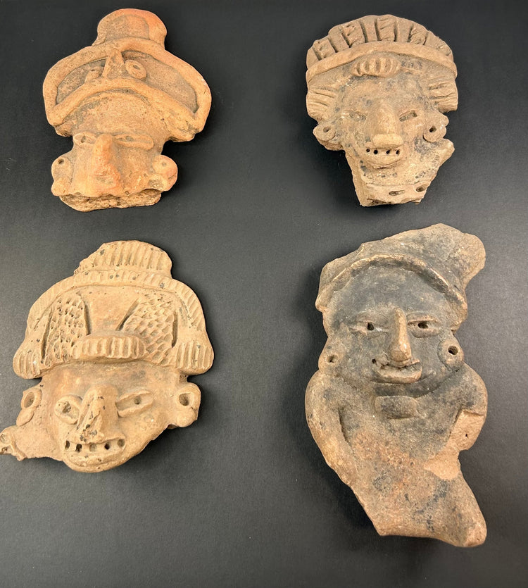 Pre-Columbian mask and face fragments, mounted together on white background