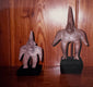 Period photograph of the two Ancient Pre-Columbian Colima Gingerbread terracotta figures displayed in the McMillan Collection during the 1980s