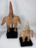 Side profile of two Pre-Columbian Colima terracotta funerary figures with archaeological surfaces