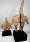 Three-quarter view of Pre-Columbian Colima terracotta figures with mineral deposits and burial patina