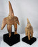 Ancient Colima terracotta figures displayed together on custom museum mounts