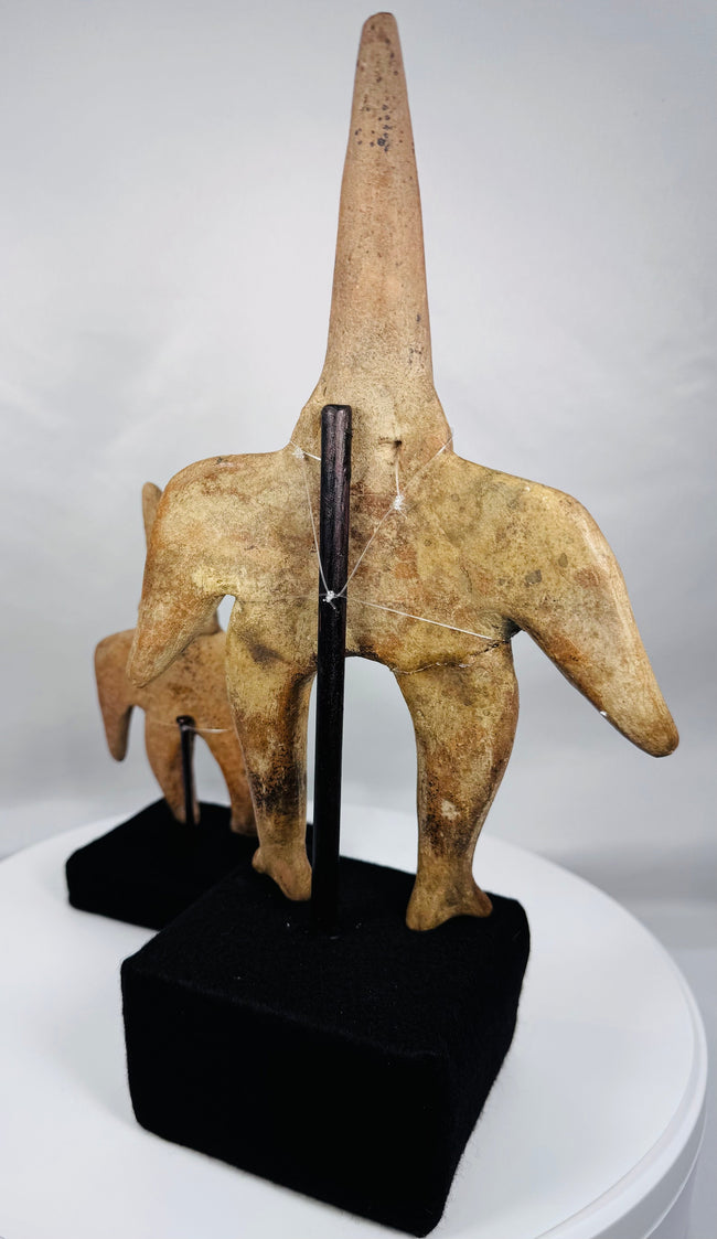 Front view of Ancient Colima Gingerbread terracotta figures with elongated conical heads