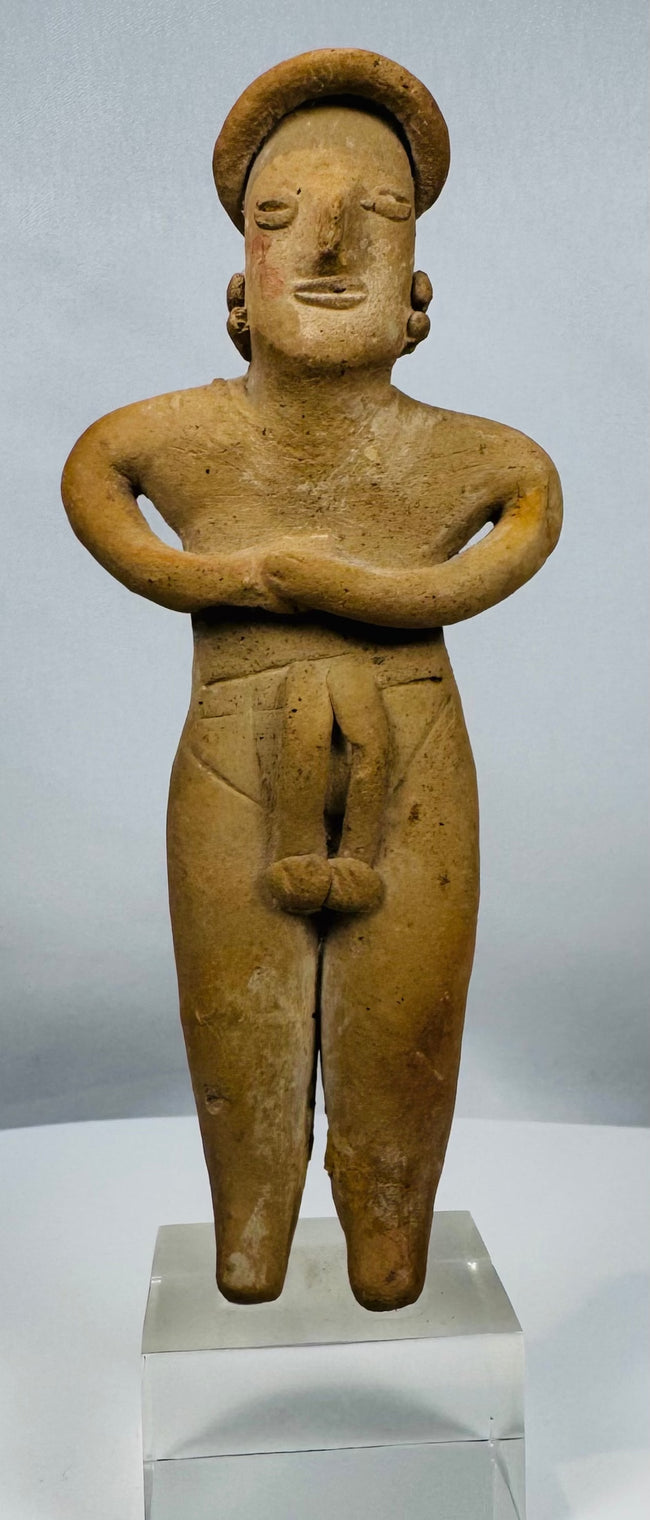Ancient Colima female fertility figure in terracotta mounted on a lucite display stand.