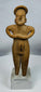 Hand-modeled Colima female figure showing folded-arm posture and traditional funerary symbolism.