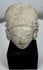 Terracotta human head from the Colima, Jalisco, or Nayarit region mounted on a custom display stand.