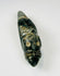 Pre-Columbian carved stone pendant with drilled hole and compact sculptural form
