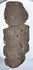 Back view of Pre-Columbian Guerrero stone figure showing flattened reverse and natural volcanic stone texture