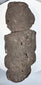 Back view of Pre-Columbian Guerrero stone figure showing flattened reverse and natural volcanic stone texture