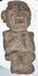 Ancient Guerrero stone figure highlighting carved facial details and textured archaeological surface