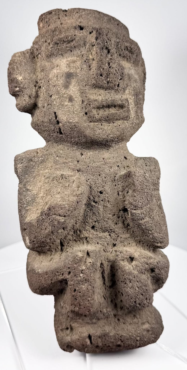 Dark volcanic stone figure from Guerrero tradition with strong geometric facial features