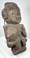 Ancient Mexican stone sculpture with projecting nose, lateral ear forms, and compact body