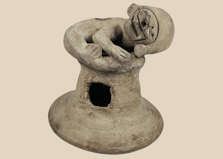 Pre-Columbian Manteño terracotta incensario from coastal Ecuador featuring a recumbent anthropomorphic figure and ceremonial vent openings.