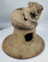 Ancient Manteño terracotta ceremonial vessel lid with stylized human figure and ritual incense vents.